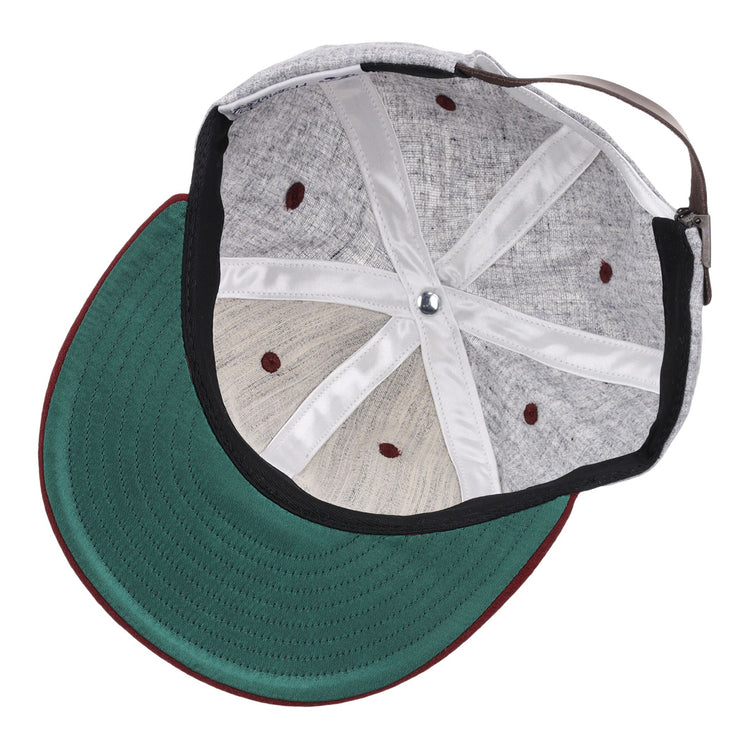 Interior view of the EFF University of South Carolina 1949 Vintage Ballcap shows a green underbrim, maroon edge, visible interior panels and seams, plus a brown adjustable strap.