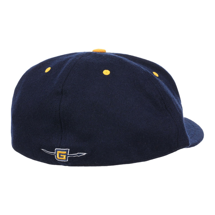 The EFF University of North Carolina Greensboro Mascot Vintage Ballcap is a navy cap with yellow ventilation holes and a small embroidered G logo with wing detail on the back, evoking classic college sports style.