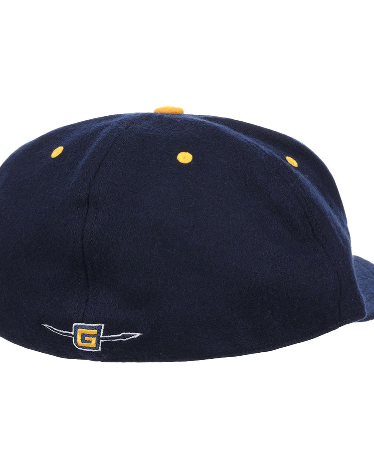 The EFF University of North Carolina Greensboro Mascot Vintage Ballcap is a navy cap with yellow ventilation holes and a small embroidered G logo with wing detail on the back, evoking classic college sports style.
