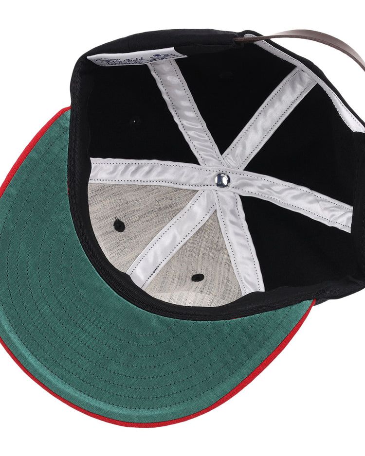 The image shows the inside of an EFF Rutgers University 1955 Vintage Ballcap featuring a green brim underside, red edge, white stitching, and a black adjustable back strap.