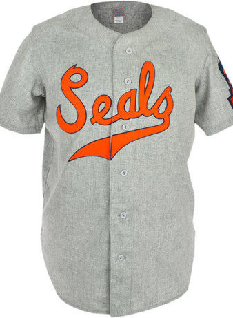 The EFF San Francisco Seals 1938 Road Jersey is a vintage gray button-up flannel with bold orange Seals script on the chest and a Pacific Coast League patch on the left sleeve—an authentic baseball classic.