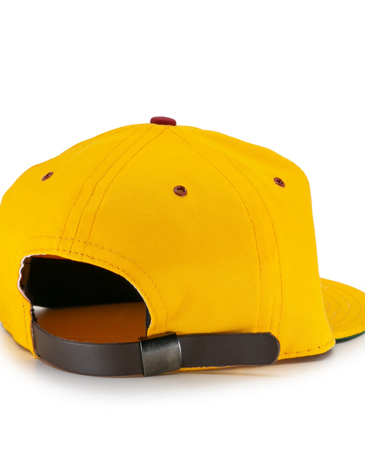 The EFF Albuquerque Dukes Cotton Twill Ballcap is yellow, shown from the back with a brown adjustable strap and red embroidered eyelets.