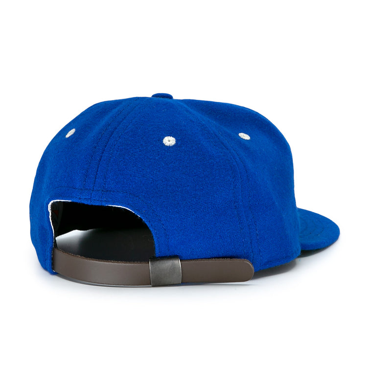 The Almendares Alacranes 1947 Vintage Ballcap by Ebbets Field Flannels is a blue wool hat shown from the back, featuring a dark adjustable strap and two white ventilation eyelets on each side.