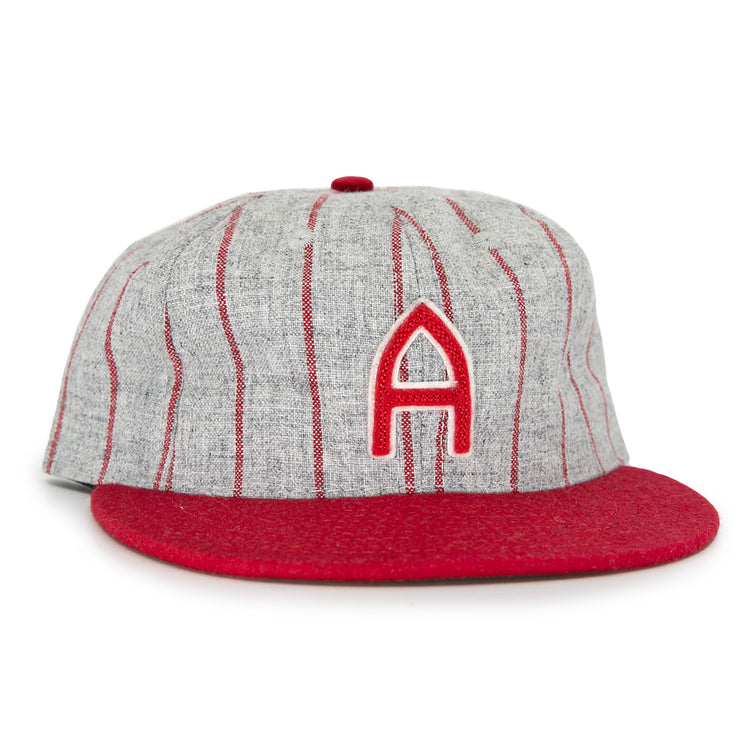 The Club Artemisa 1943 Vintage Ballcap by Ebbets Field Flannels features genuine grey wool, thin red stripes, a red brim, and a bold red A on the front, inspired by the Cuban National Amateur League team.