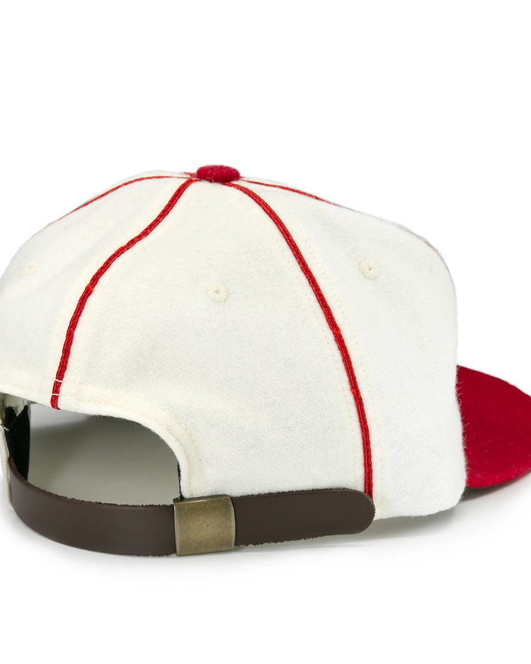 The EFF Asahi Vancouver 1940 Vintage Ballcap features red stitching, a red brim, and a brown leather strap with brass buckle—ideal for collectors or fans of Japanese-Canadian teams. Shown from the back.