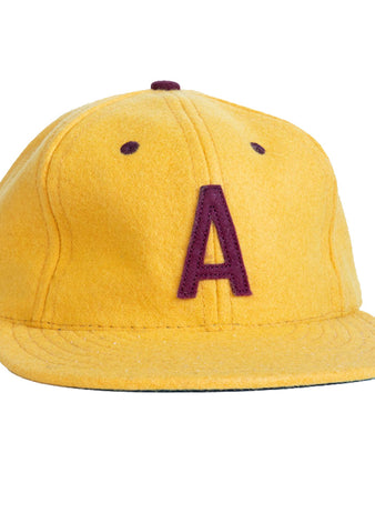 The EFF Arizona State University 1955 Vintage Ballcap is yellow with a maroon A embroidered on the front, features a flat brim, and is an officially licensed college product.