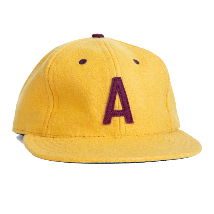 The EFF Arizona State University 1955 Vintage Ballcap is yellow with a maroon A embroidered on the front, features a flat brim, and is an officially licensed college product.