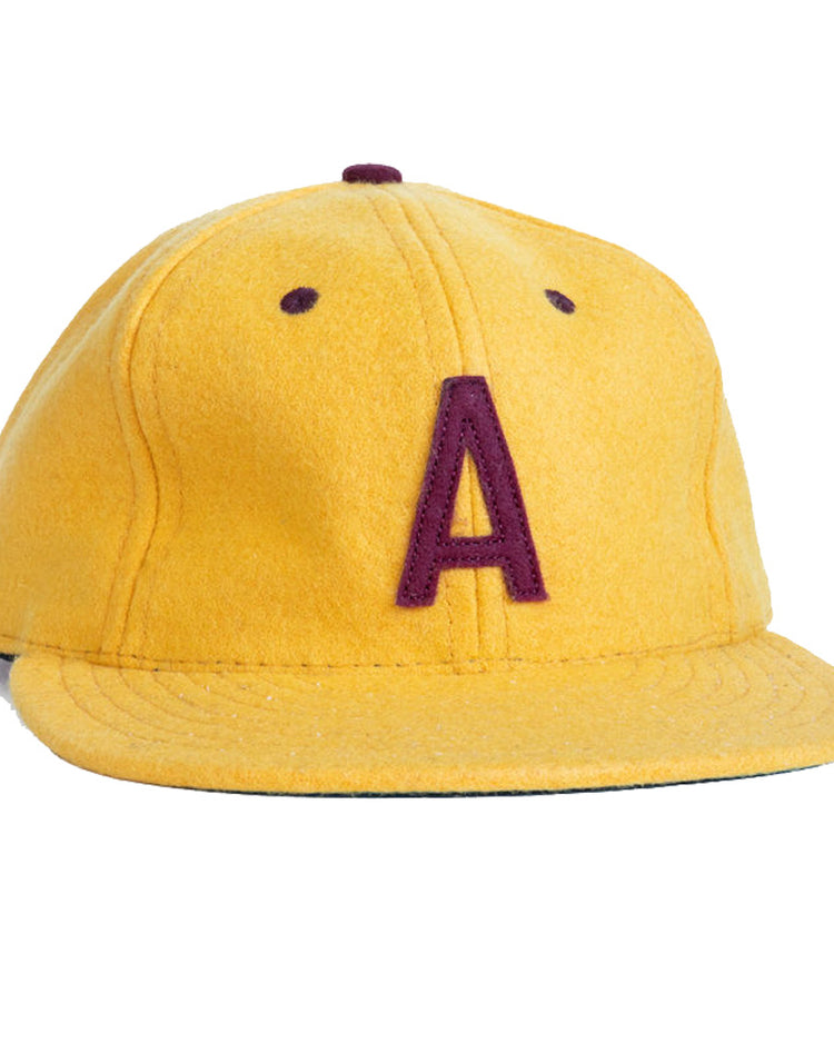 The EFF Arizona State University 1955 Vintage Ballcap is yellow with a maroon A embroidered on the front, features a flat brim, and is an officially licensed college product.
