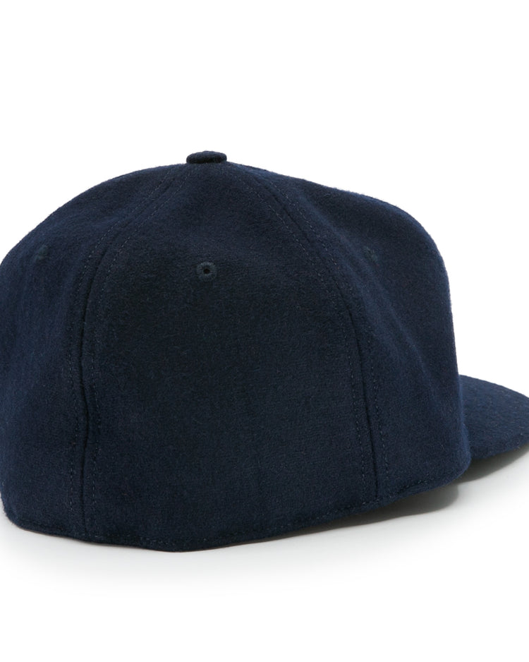 The Auburn University 1966 Vintage Ballcap by Ebbets Field Flannels is a navy blue wool baseball cap with a round crown and curved brim, viewed from the back. It features soft fabric, no adjustable strap, and a classic logo-free design.