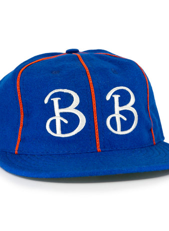 The EFF Boston Bloomer Girls 1910 Vintage Ballcap features royal blue fabric, red piping, and bold white intertwined B embroidery, inspired by the historic womens baseball team.