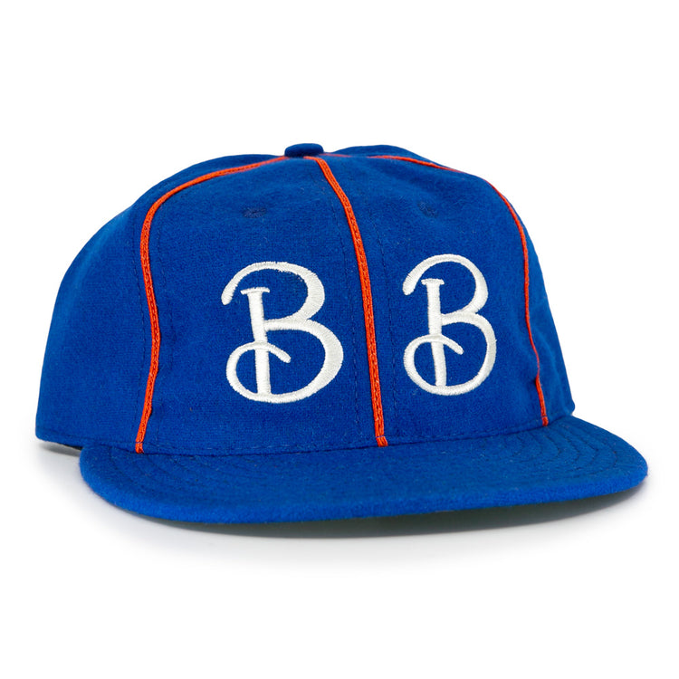 The EFF Boston Bloomer Girls 1910 Vintage Ballcap features royal blue fabric, red piping, and bold white intertwined B embroidery, inspired by the historic womens baseball team.