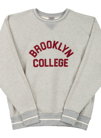 The EFF Brooklyn College Collegiate Vintage Crewneck Sweatshirt features light gray French terry fabric, bold maroon BROOKLYN COLLEGE print, and striped white/gray cuffs and hem for a timeless collegiate style.