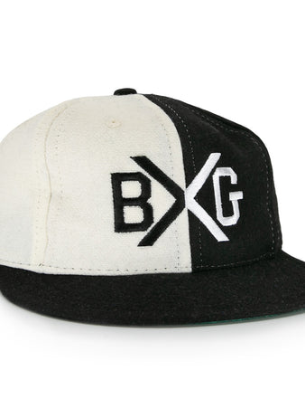 The EFF Bacharach Giants 1924 Vintage Ballcap is crafted from genuine wool and features black and white color blocks, a flat brim, and bold BXG embroidery on the front, inspired by the classic 1924 design.