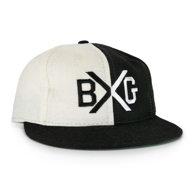 The EFF Bacharach Giants 1924 Vintage Ballcap is crafted from genuine wool and features black and white color blocks, a flat brim, and bold BXG embroidery on the front, inspired by the classic 1924 design.