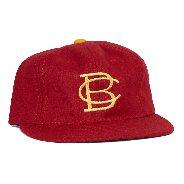 The EFF Boston College 1966 Vintage Ballcap features a red design, a yellow BC logo embroidered on the front, and a yellow top button—an authentic reproduction of the classic Eagles cap.