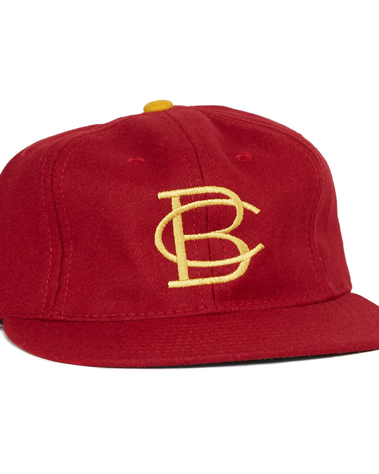 The EFF Boston College 1966 Vintage Ballcap features a red design, a yellow BC logo embroidered on the front, and a yellow top button—an authentic reproduction of the classic Eagles cap.