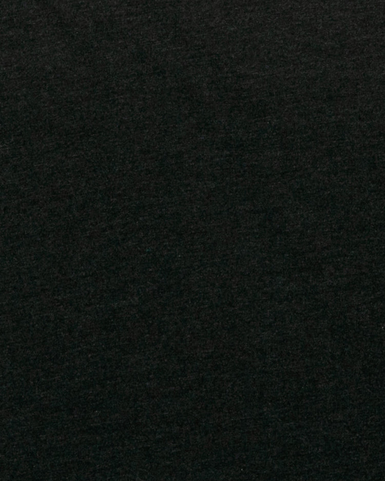 A close-up of the dark, textured fabric of the EFF Chicago American Giants T-Shirt, inspired by the classic Negro League uniforms.