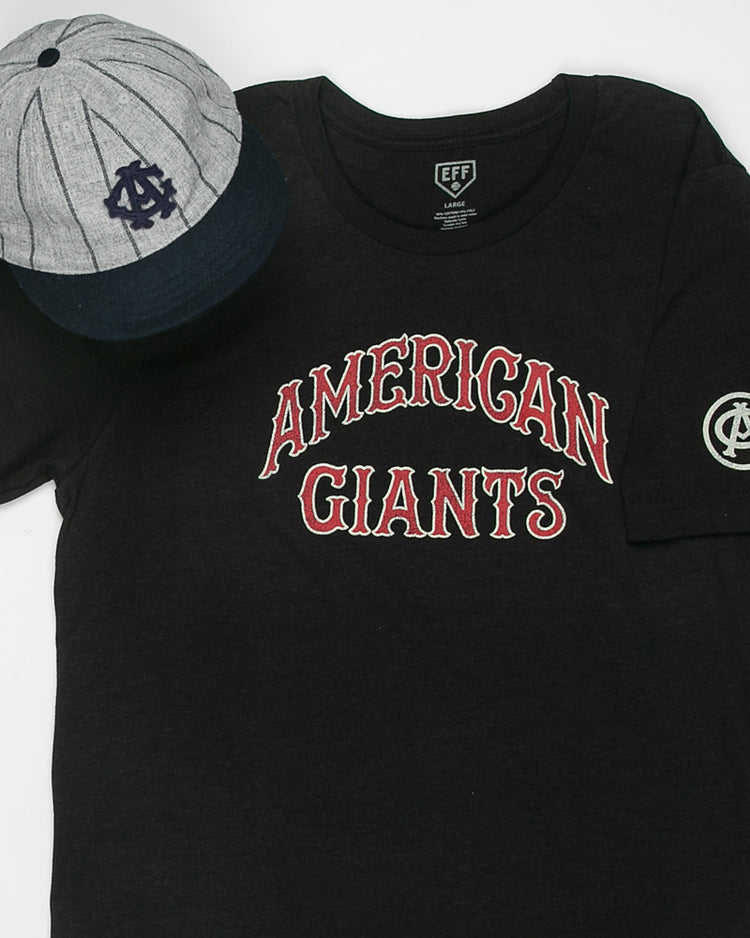 The EFF Chicago American Giants T-Shirt in black features red and white lettering and a sleeve emblem, shown beside a gray and navy blue baseball cap with an AG logo—both honoring Negro League Black baseball history.