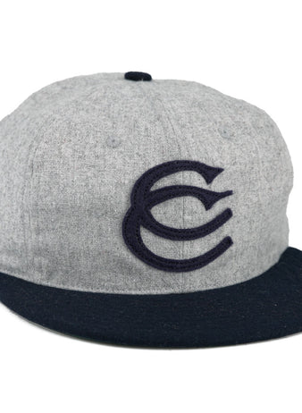 The EFF Cerveceria Caracas 1942 Vintage Ballcap is a gray cap with a navy brim and bold embroidered CC logo, inspired by the 1942 Venezuelan League classic.