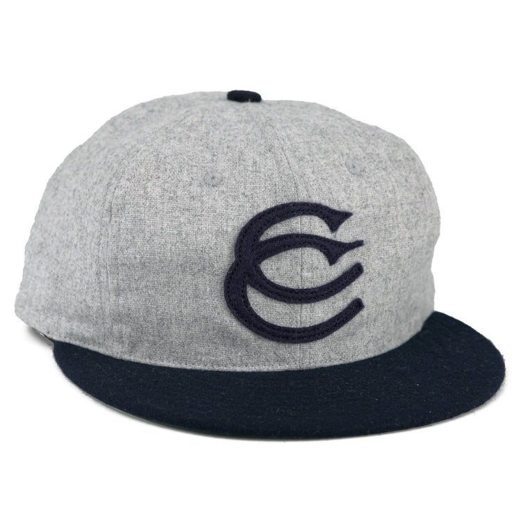 The EFF Cerveceria Caracas 1942 Vintage Ballcap is a gray cap with a navy brim and bold embroidered CC logo, inspired by the 1942 Venezuelan League classic.