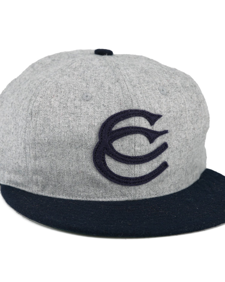The EFF Cerveceria Caracas 1942 Vintage Ballcap is a gray cap with a navy brim and bold embroidered CC logo, inspired by the 1942 Venezuelan League classic.