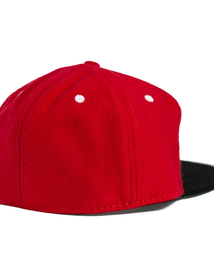 The University of Cincinnati 1960 Vintage Ballcap by Ebbets Field Flannels features a red body with white stitched dots and a black flat brim, authentically reproduced and shown from back and side against a white background.