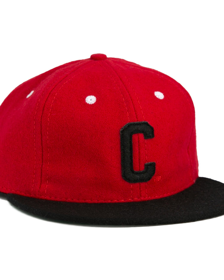 The University of Cincinnati 1960 Vintage Ballcap by Ebbets Field Flannels is a red cap with a black bill, white stitching, and a bold black “C,” authentically reproducing the classic look of the original.