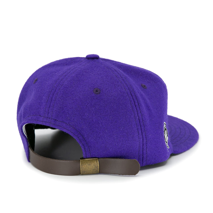 The EFF Cleveland Falcons 1936 Vintage Ballcap is a purple wool cap viewed from the back, with a brown adjustable leather strap, brass buckle, and a small embroidered side logo.