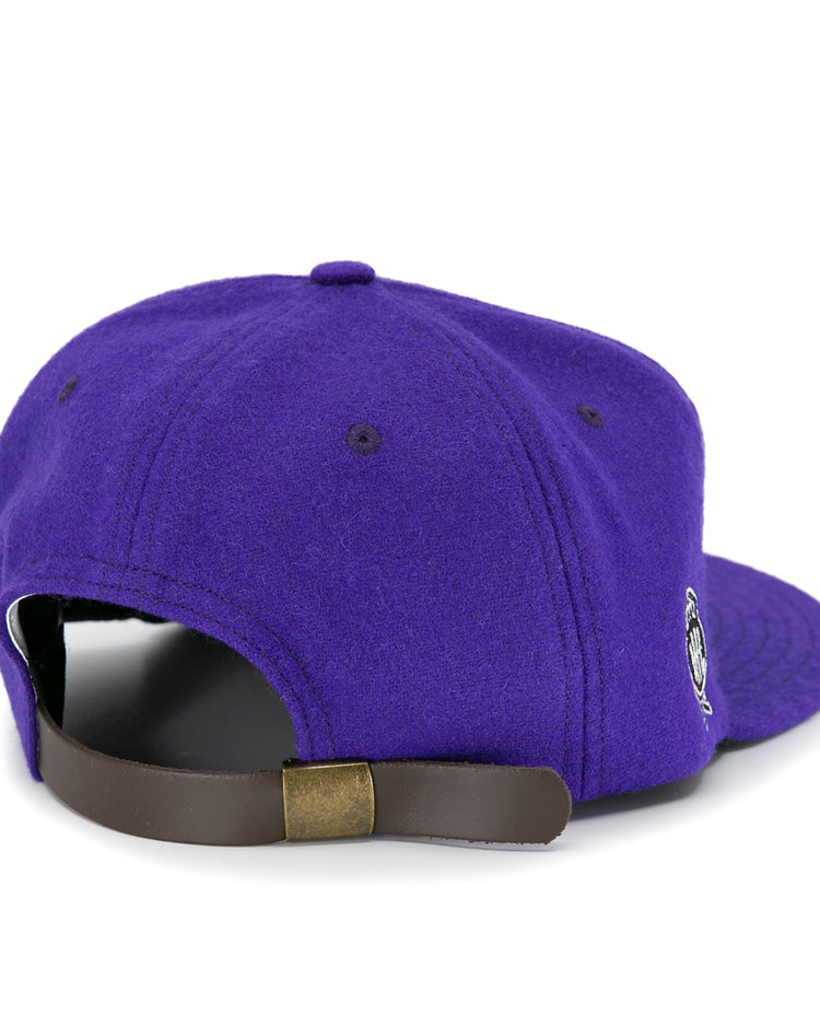 The EFF Cleveland Falcons 1936 Vintage Ballcap is a purple wool cap viewed from the back, with a brown adjustable leather strap, brass buckle, and a small embroidered side logo.