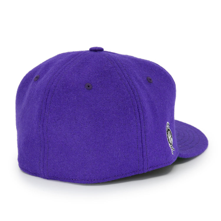 The EFF Cleveland Falcons 1936 Vintage Ballcap is a purple wool cap shown from the back, with stitched panels, a top button, an adjustable leather strap, and a small round embroidered logo on the side.