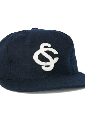 The EFF Colorado Springs Sky Sox 1953 Vintage Ballcap is a navy wool hat featuring a white interlocking S and C logo, inspired by classic Sky Sox caps.