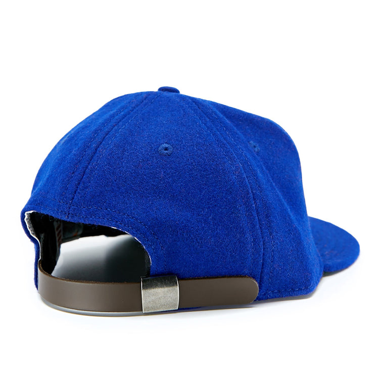 The EFF Cuban Stars 1932 Vintage Ballcap is shown from the back in blue, featuring a dark brown adjustable strap with a silver clasp and soft, felt-like material inspired by classic East-West League styles.
