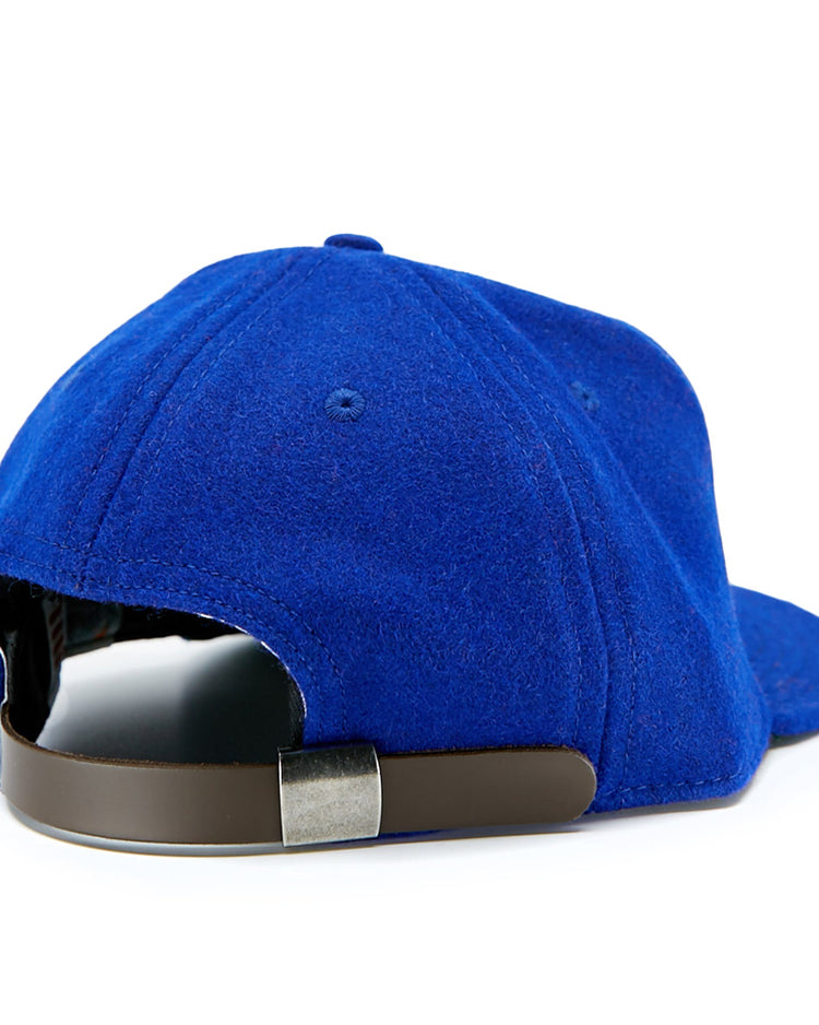 The EFF Cuban Stars 1932 Vintage Ballcap is shown from the back in blue, featuring a dark brown adjustable strap with a silver clasp and soft, felt-like material inspired by classic East-West League styles.