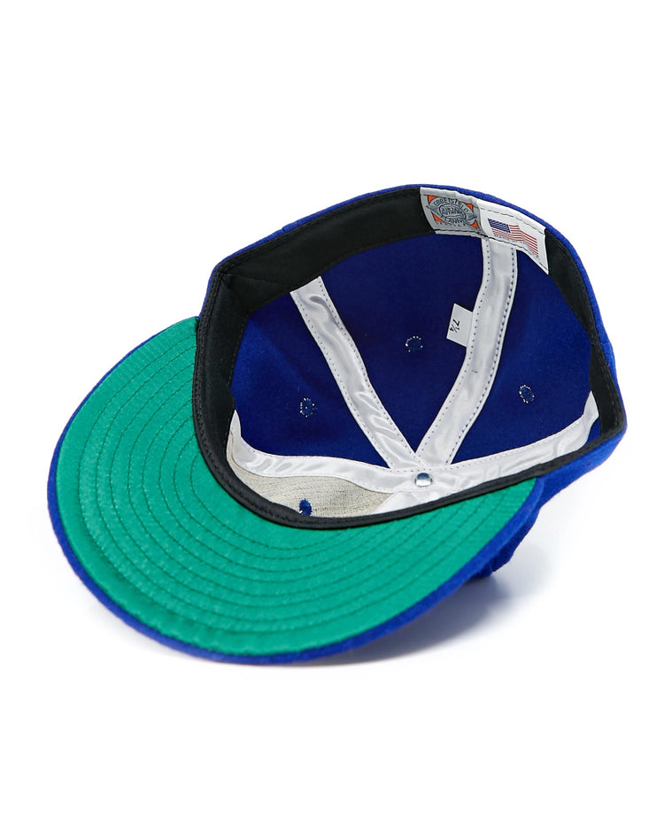 A vintage EFF Cuban Stars 1932 Vintage Ballcap shown from underneath displays a green brim, white lining, visible stitching, and interior labels—a classic tribute to the historic team.