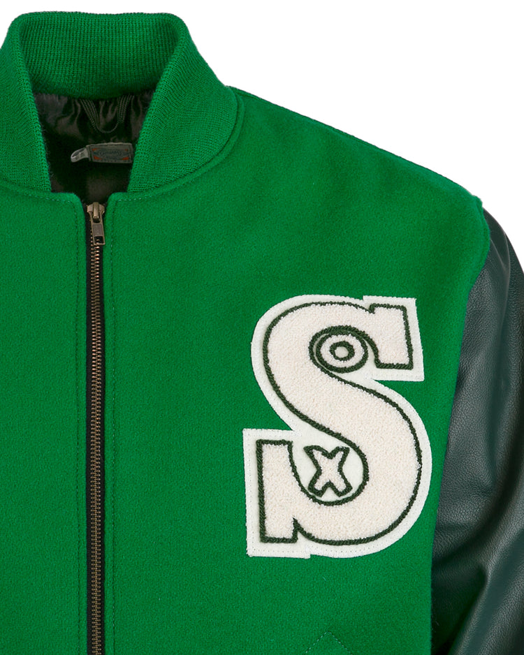 The EFF Chicago White Sox 1932 Authentic Jacket features kelly green wool, black leather sleeves, a black zipper, and a bold white “S” patch outlined in black on the left chest—evoking vintage varsity style.