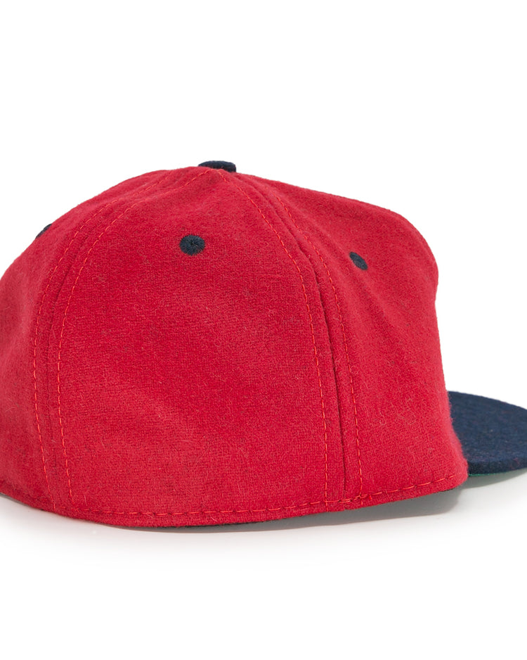 The EFF Deland Red Hats 1939 Vintage Ballcap features a red wool crown with a dark blue brim, shown from the back and side on a white background. Ideal for vintage ballcap collectors.
