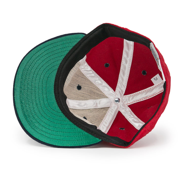 The EFF Deland Red Hats 1939 Vintage Ballcap, size XL, is turned inside out to reveal its green brim, black-and-white inner seams, white size tag, and black ventilation holes on the wool lining.