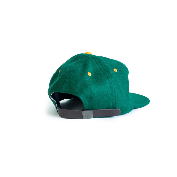 The EFF University of San Francisco 1950 Vintage Ballcap is shown from the back, featuring green wool, yellow eyelets, and a brown adjustable strap against a white background.