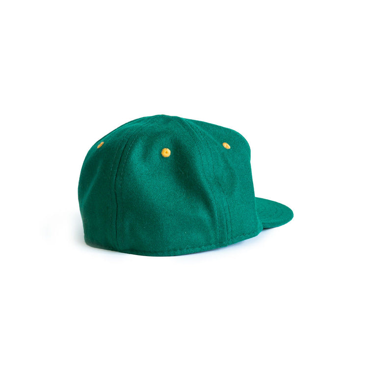 The EFF University of San Francisco 1950 Vintage Ballcap is green with a flat brim, yellow eyelets, and is pictured from the back at an angle against a plain white background.