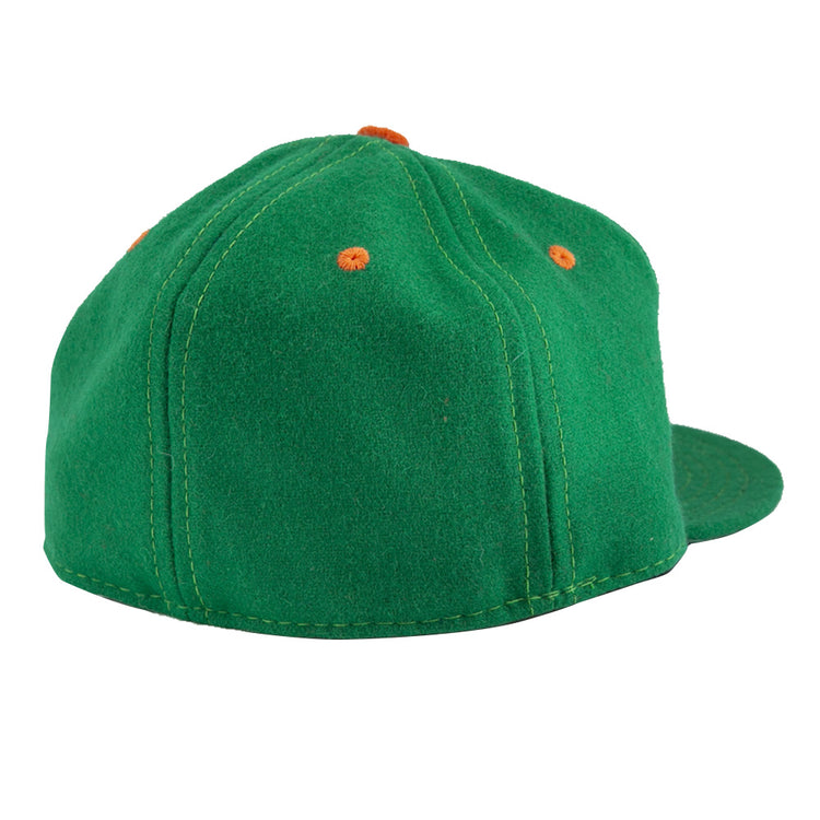 The EFF Dublin Green Sox 1951 Vintage Ballcap, shown from the back and slightly to the side, features green fabric with orange stitched eyelets.