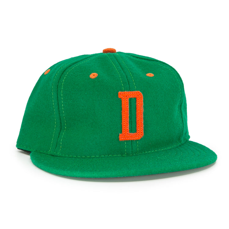 The EFF Dublin Green Sox 1951 Vintage Ballcap features a green body with an orange D front logo plus orange accents on the top button and ventilation holes.