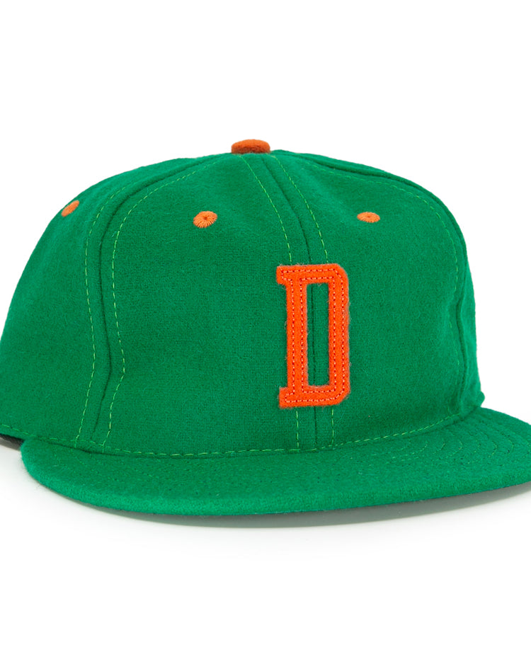 The EFF Dublin Green Sox 1951 Vintage Ballcap features a green body with an orange D front logo plus orange accents on the top button and ventilation holes.