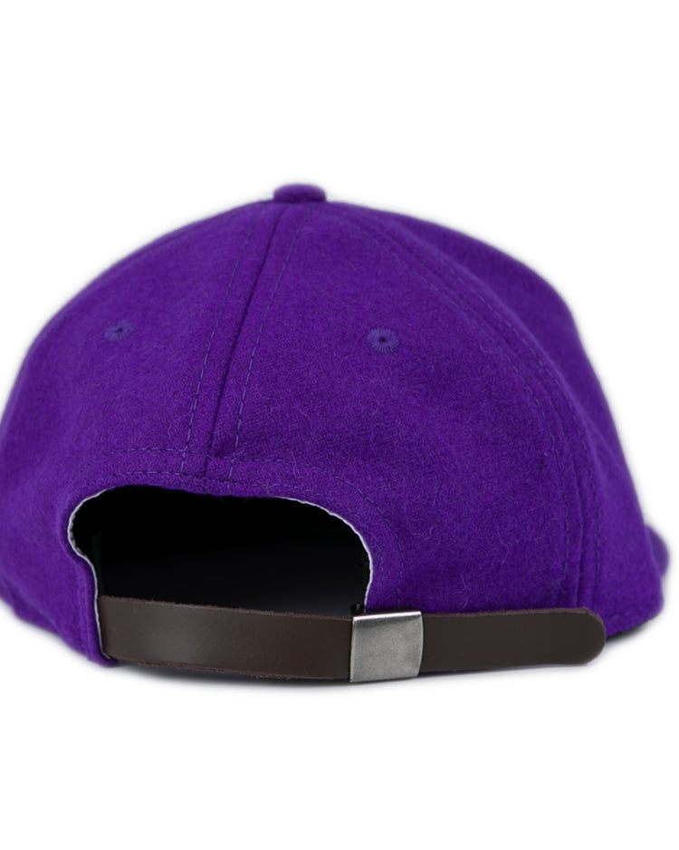 A close-up of the back of the East Carolina University 1961 Vintage Ballcap by Ebbets Field Flannels, featuring a brown adjustable strap and metal clasp, set against a white background.