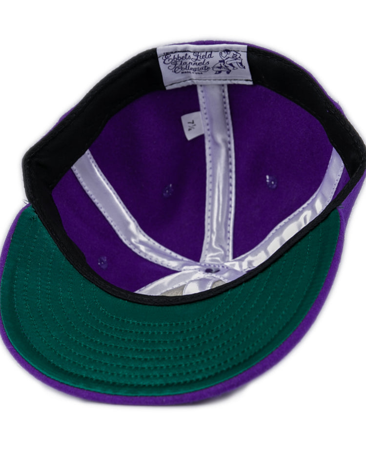 The East Carolina University 1961 Vintage Ballcap by Ebbets Field Flannels is shown from the inside, highlighting the green underside of the brim, a white sweatband, a 7 1/4 size tag, and shiny white interior lining.