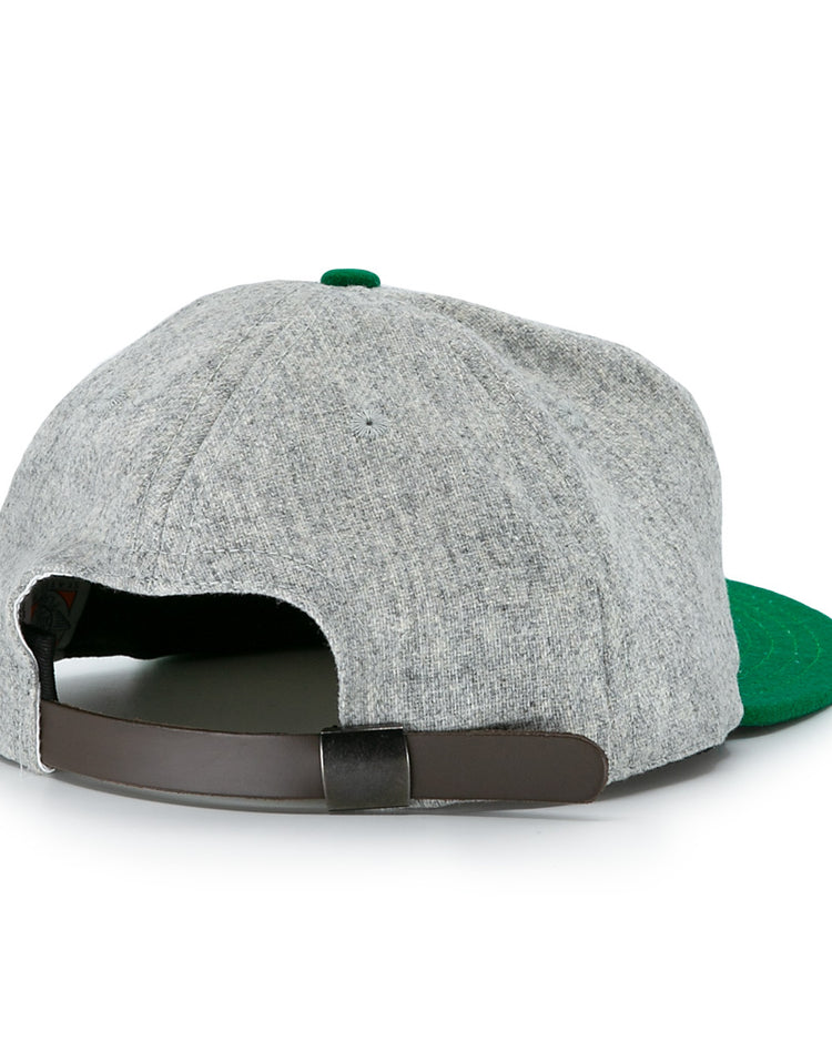 The Ebbets Field Flannels Cienfuegos Elefantes 1946 Vintage Ballcap features gray wool, a green brim, a brown adjustable strap, and a green top button—classic Cuban Professional League style shown from the back.
