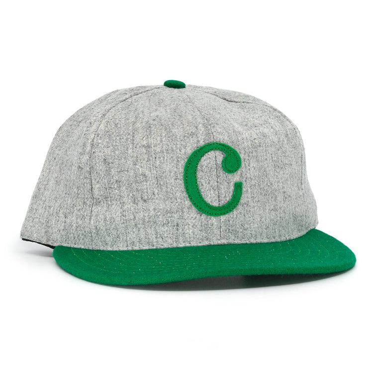 The Ebbets Field Flannels Cienfuegos Elefantes 1946 Vintage Ballcap is a gray wool cap with a green brim and an embroidered green “C,” inspired by the classic Cuban Professional League team.
