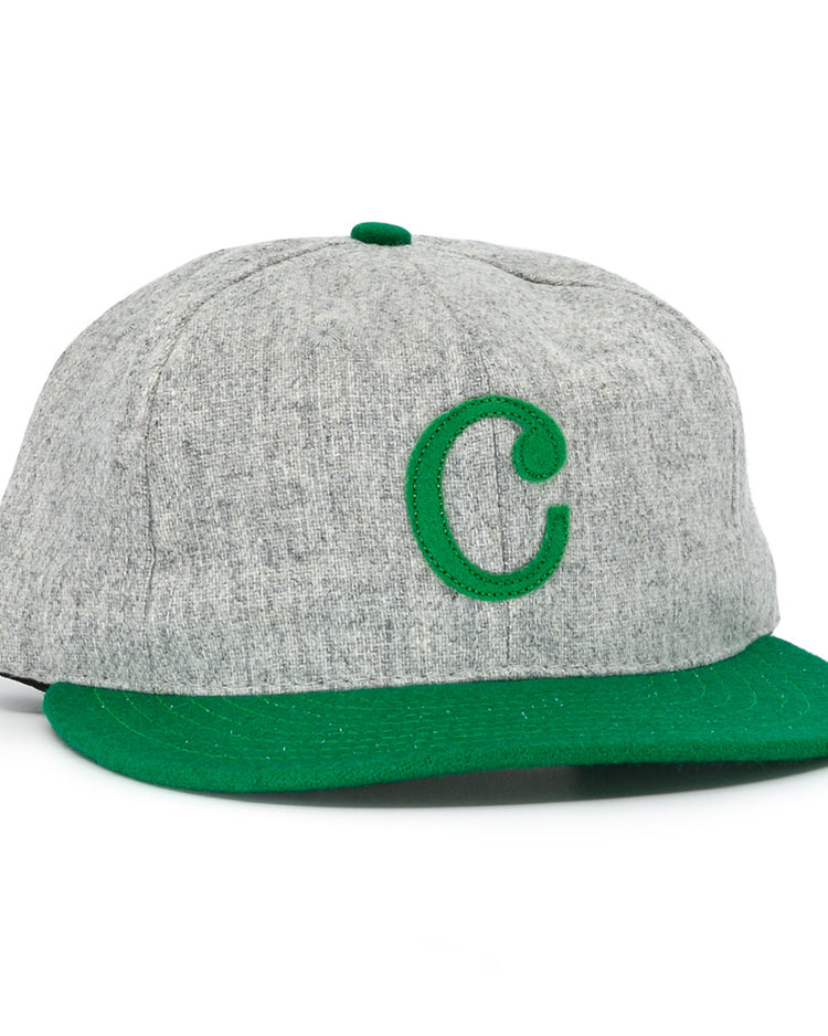 The Ebbets Field Flannels Cienfuegos Elefantes 1946 Vintage Ballcap is a gray wool cap with a green brim and an embroidered green “C,” inspired by the classic Cuban Professional League team.