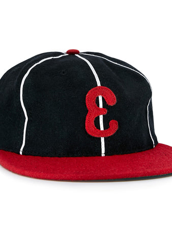 The EFF Escogido Leones 1952 Vintage Ballcap is a black cap with thin white stripes, a red brim, and a bold red E on the front—authentically recreating the Dominican League classic.