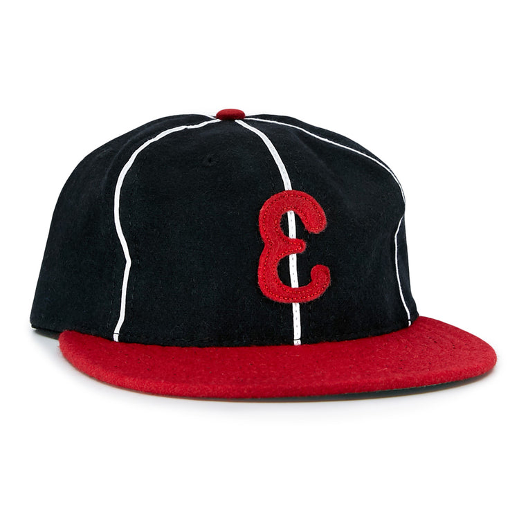 The EFF Escogido Leones 1952 Vintage Ballcap is a black cap with thin white stripes, a red brim, and a bold red E on the front—authentically recreating the Dominican League classic.