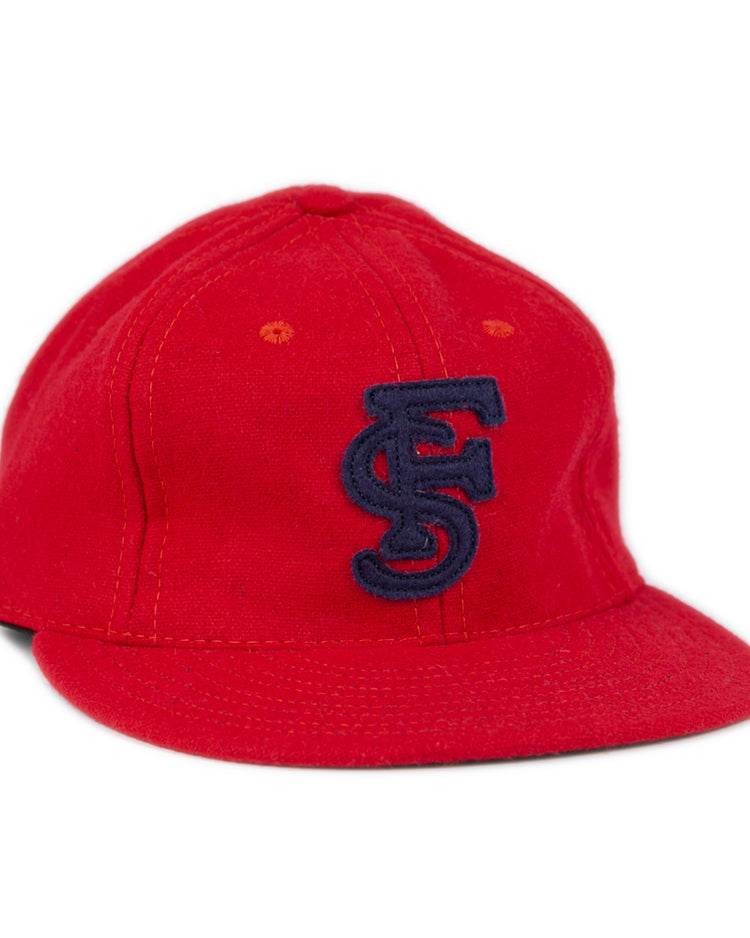 The Fresno State University 1951 Vintage Ballcap by Ebbets Field Flannels features a red flat brim and a navy blue embroidered FS logo, displayed against a white background.